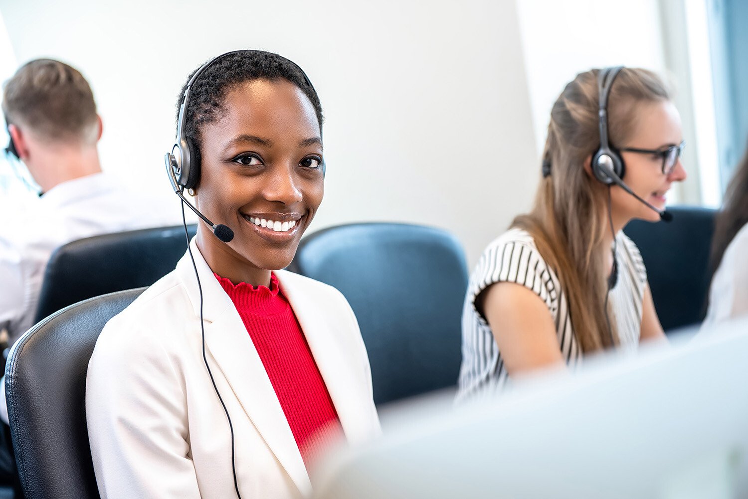 African-American-woman-working-call-center-office-diverse-team-1151683294_6016x4016
