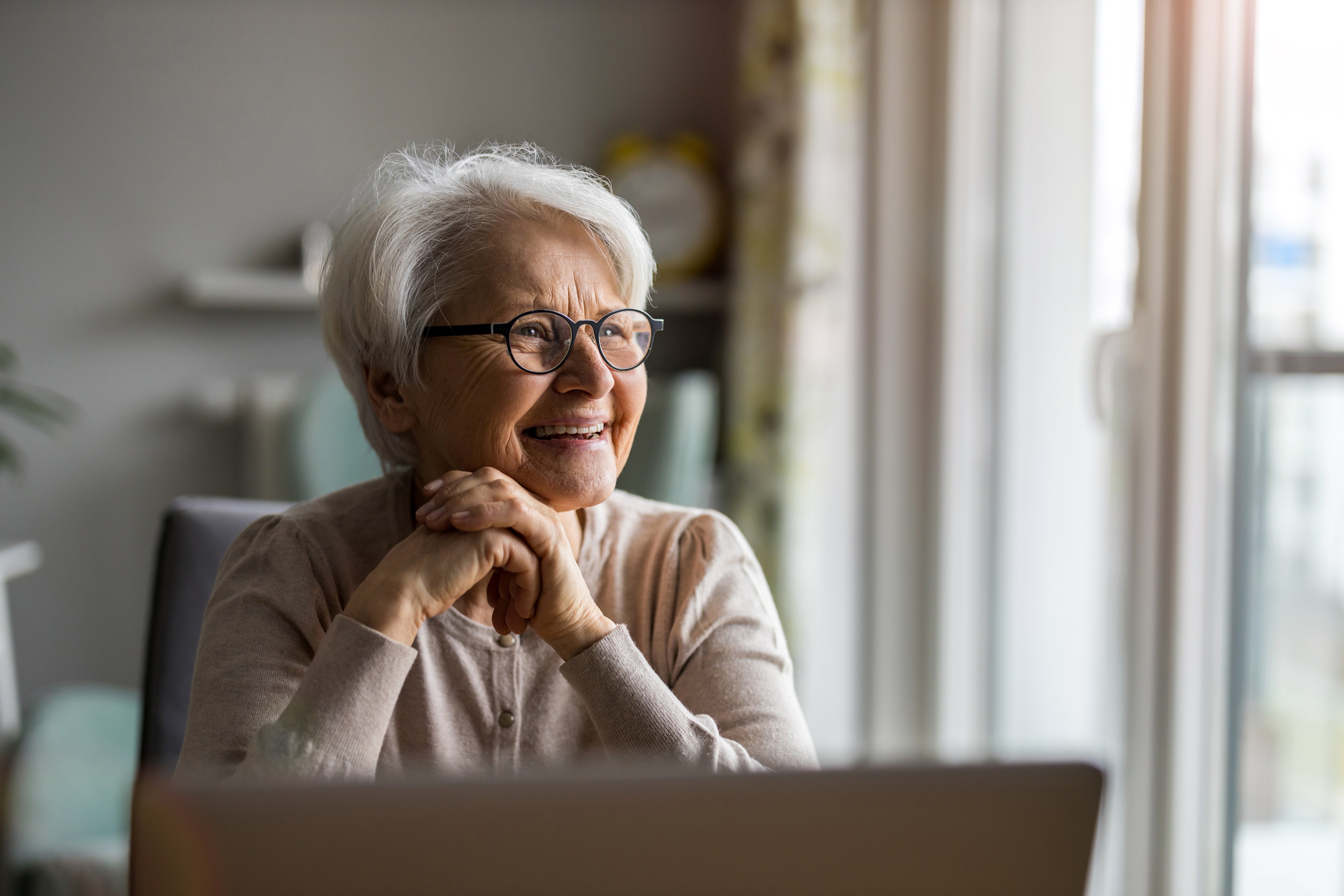 female-european-elderly-indoor-using-laptop-at-home-web